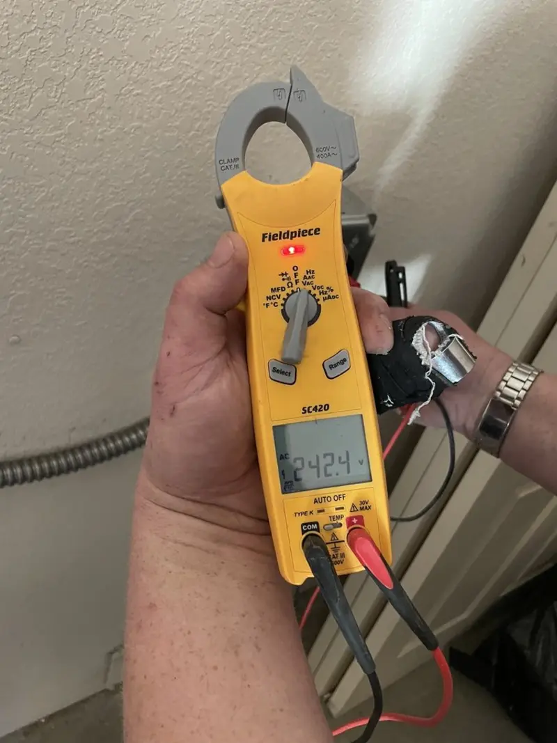 Voltage testing with clamp meter during Whole House Surge Protector in Kings Point